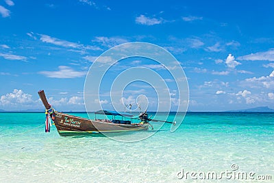 Thai wooden boat on the coast of the Andaman Sea. Boat trip in this typical long tail boat. Editorial Stock Photo