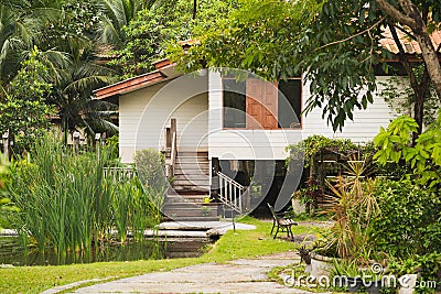Thai wooden house in the garden Stock Photo