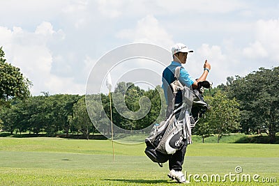 Thai young golf player in golf course and prepare for practice time before enter in golf tournament in Chiang rai,Thailand Editorial Stock Photo