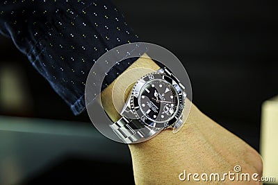 Thailand - AUGUST 19, 2018: luxury watches Rolex on his hand. Editorial Stock Photo