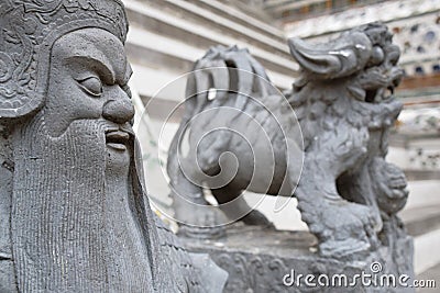 Carved stone warrior guards the temple of dawn Editorial Stock Photo