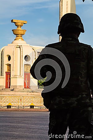 Thailand Democracy Monument with soldier silhouette Editorial Stock Photo