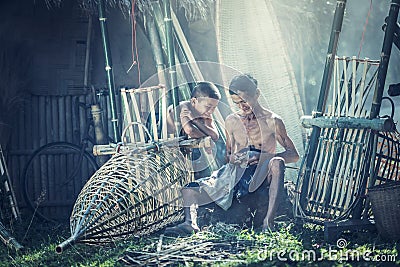 Thailand Father and son are working hand made Basket bamboo or fishing gear Stock Photo