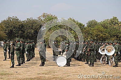Thailand, 11 Jan 2022, a group of male soldiers wearing masks, stand in line for military training outdoors in the morning. Editorial Stock Photo