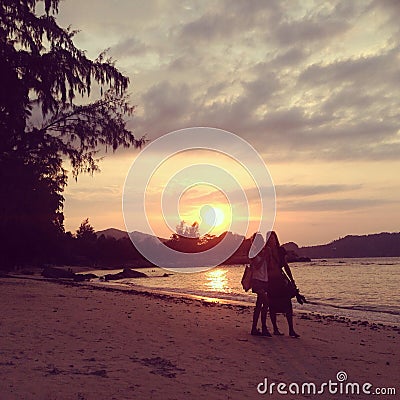 Thailand KoPhangan sunset lovers girl boy love beach sand sea nature cloud trees Editorial Stock Photo