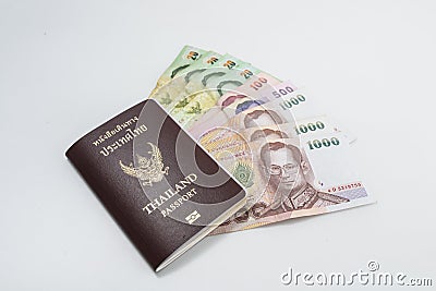 Thailand passport with Thai money ready to travel Stock Photo