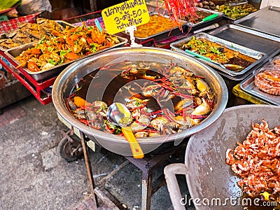 THAILAND, SAMUTSONGKHRAM - JUNE 17: Traditional thai steet food at Amphawa floating market in Thailand.Amphawa floating market can Stock Photo