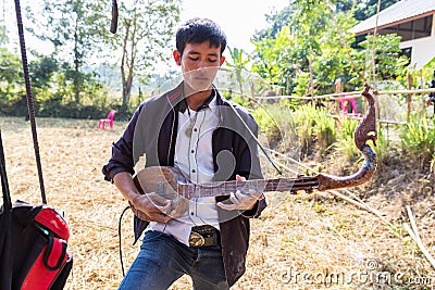 Thailand traditional musician playing folk music Editorial Stock Photo