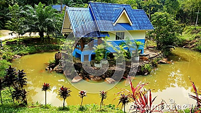 Thailand Unique Home surrounded with water. Stock Photo