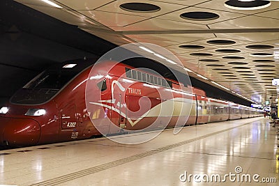 Thalys international train from Amsterdam to Paris along platform at station Schiphol Airport in Amsterdam Editorial Stock Photo