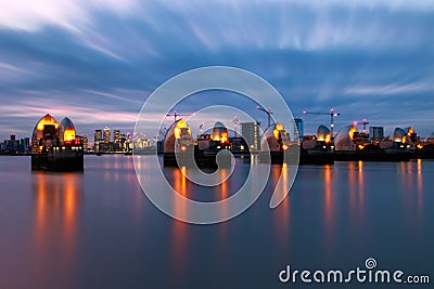 Thames Barrier and Canary Wharf in London Stock Photo