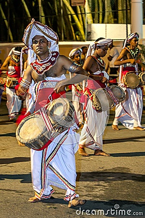Thammattam Players perform at the Esala Perahera in Kandy, Sri Lanka. Editorial Stock Photo