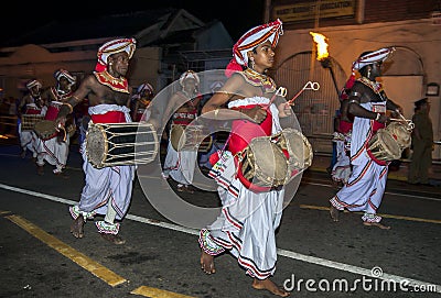 Thammattam Players (right) lead a group of Davul Players as they perform during the Esala Perahera in Kandy, Sri Lanka. Editorial Stock Photo