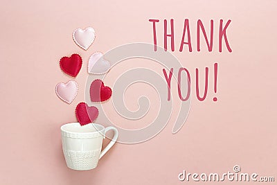 Thank you message and coffee cup with hearts coming out of it o Stock Photo