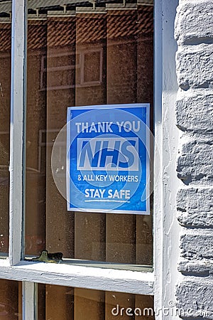 A Thank You NHS & All Key Workers Sign in a house window Editorial Stock Photo