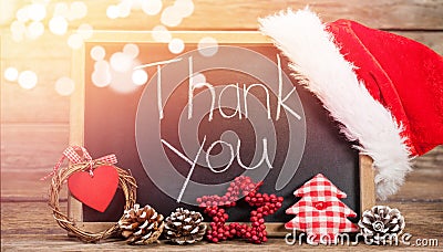 Thank you text on slate with decorations on wooden table Stock Photo