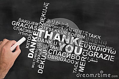 Thank you in various languages on blackboard Stock Photo