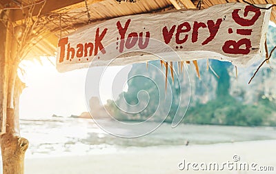 `Thank You very BIG` sign in exotic bungalow on the sandy Thai beach. Tropic vacation concept image Stock Photo