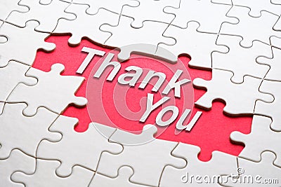 Thank you word reveal under jigsaw puzzle Stock Photo