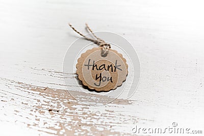 Thank you word written in a card on wooden background. Love and gratitude concept. Stock Photo