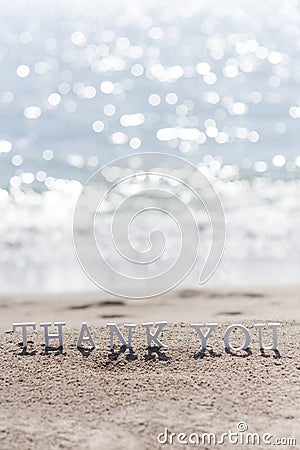 Thank you word drawn on the beach sand Stock Photo