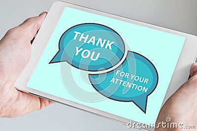 Thank you for your attention concept with hand holding modern touch screen device like tablet to be used as slide background Stock Photo