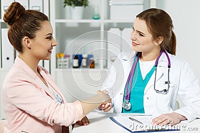 Thankful handclasp for excellent treatment Stock Photo