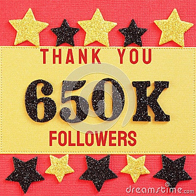 Thanks 650K, 650000 followers. message with black shiny numbers on red and gold background with black and golden shiny stars Stock Photo