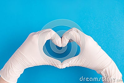 Thanks to doctors concept. First person top above overhead view photo of female doctor hands showing making heart with fingers Stock Photo
