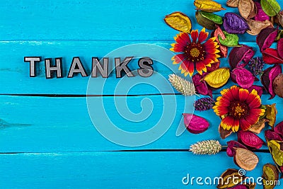 Thanks word on blue wood with flower Stock Photo