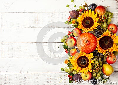 Thanksgiving background with autumn pumpkins, fruits and flowers Stock Photo