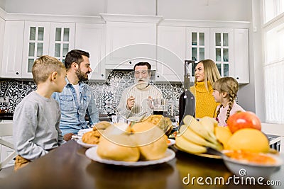 Thanksgiving Celebration Tradition Family Dinner Concept. Family with kids. Roasted turkey, fresh fruits, cookies and Stock Photo