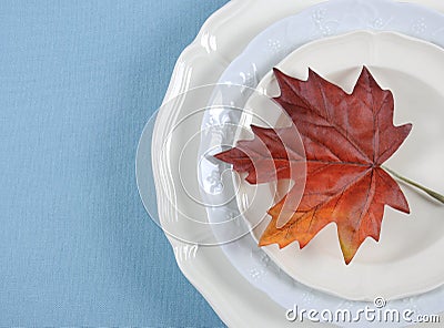 Thanksgiving dining table elegant place setting with autumn leaf with copy space. Stock Photo