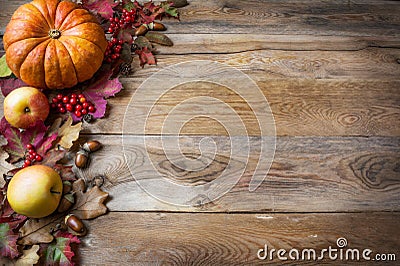 Thanksgiving or fall greeting with pumpkins, berries and fall le Stock Photo