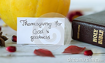 Thanksgiving for God`s goodness, a handwritten note with Holy Bible and pumpkin Stock Photo