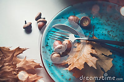 Thanksgiving holiday table served. Wooden table decorated with autumn leaves Stock Photo