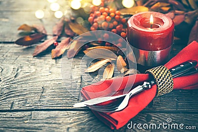 Thanksgiving holiday table served. Wooden table decorated with autumn leaves Stock Photo