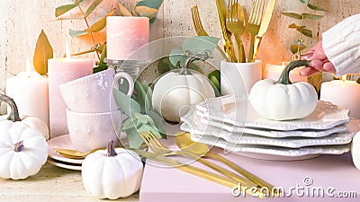 Thanksgiving stylish table setting in new season colours, blush pink and white. Stock Photo