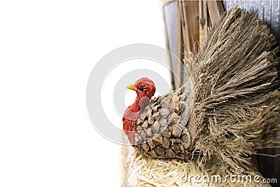 Thanksgiving turkey made out of pinecone and burlap and straw at side of white background with room for copy - selective focus Stock Photo