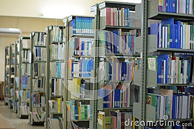 Old bookshelf with books arranged neatly in a wide variety of large libraries.. Editorial Stock Photo