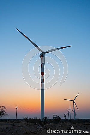 Thar desert, Rajasthan, India - 15.10.2019 : Pre dawn light in desert sky with Electrical power generating wind mills producing Editorial Stock Photo