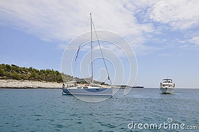 Thassos, August 21st: Yacht and Cruise Ship on the Aegean Sea near Thassos island in Greece Editorial Stock Photo