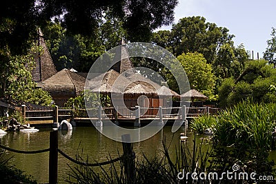 Thatched roof building in the jungle wilderness Stock Photo