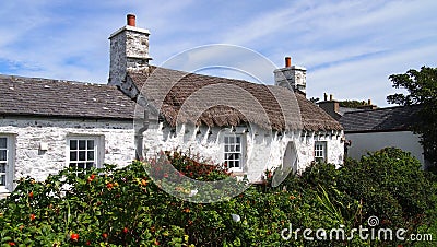 A thatched cottage in the village of Cregneash on the Isle of Man in the Irish Sea Stock Photo