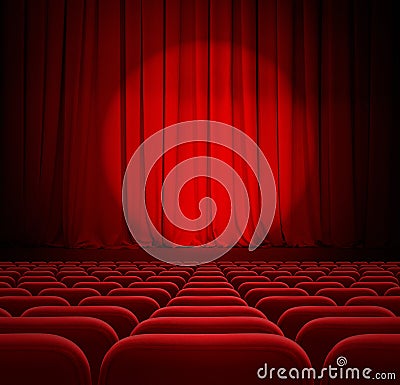 Theater or cinema red curtains with spotlight and seats Stock Photo