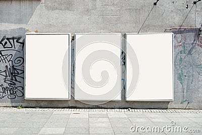 Thee empty advertising billboards on the wall of building Stock Photo