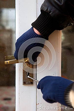 Theif breaking-in burglary security Stock Photo