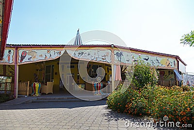 Thematic cafe exterior with Africa tribal pictures and statues Editorial Stock Photo