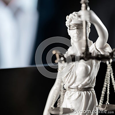 Themis figurine. Wooden judge`s gavel. The criminal law. Stock Photo