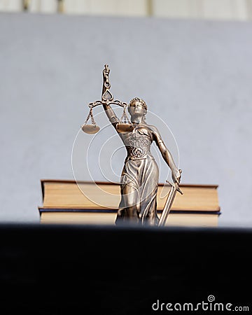 themis goddess of justice statuette, symbol of law with scales and sword in his hands Stock Photo